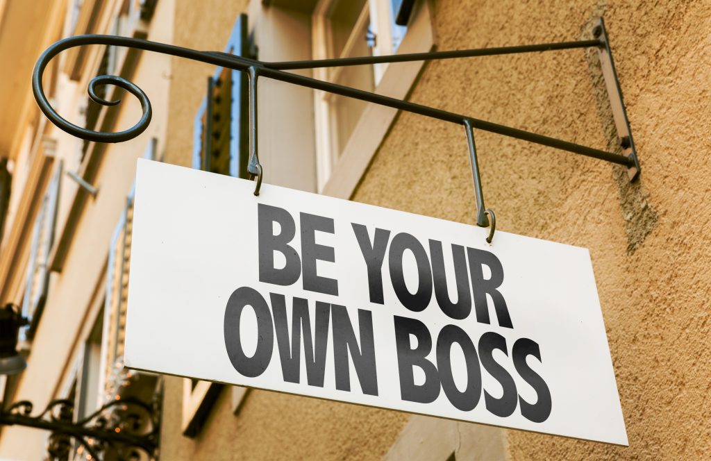 A sign with the words Be Your Own Boss